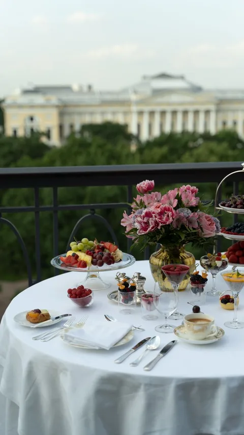 Lavish hotel terrace breakfast with pastries and fruit, Amigos de Paradores