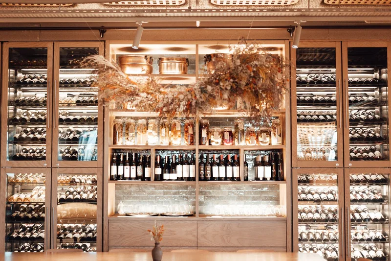 Wine cellar display with wine bottles in a Paradores restaurant in Spain