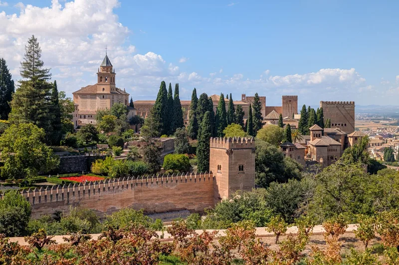 Parador de Granada and Alhambra palace walls surrounded by gardens
