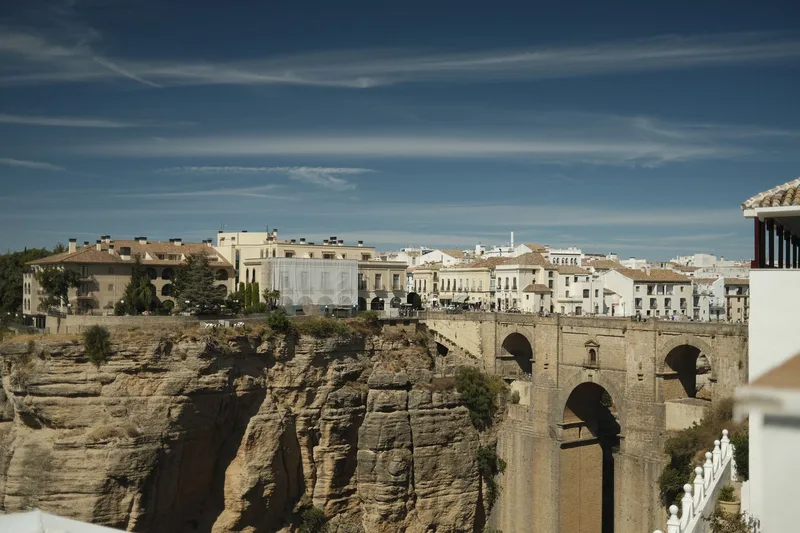 Parador de Ronda and Puente Nuevo above El Tajo Gorge in daylight