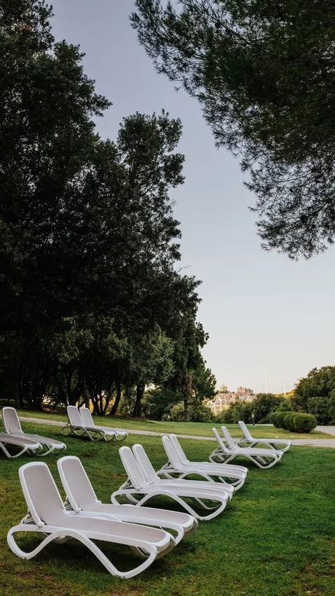 White sun loungers on garden lawn at Parador de Ronda
